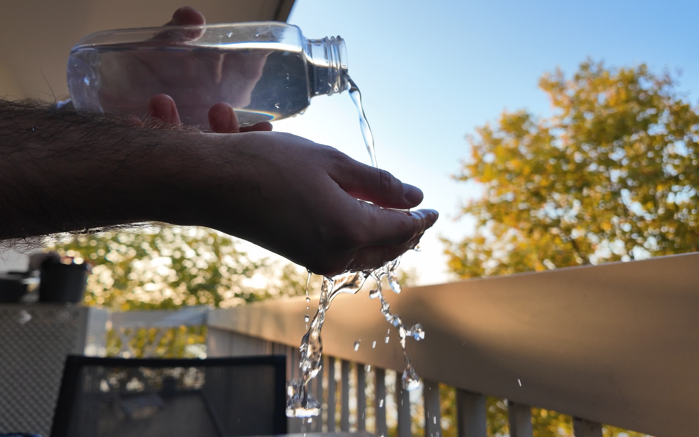 Close-up texture of clean, clear water splashing, symbolizing hygiene and purity.